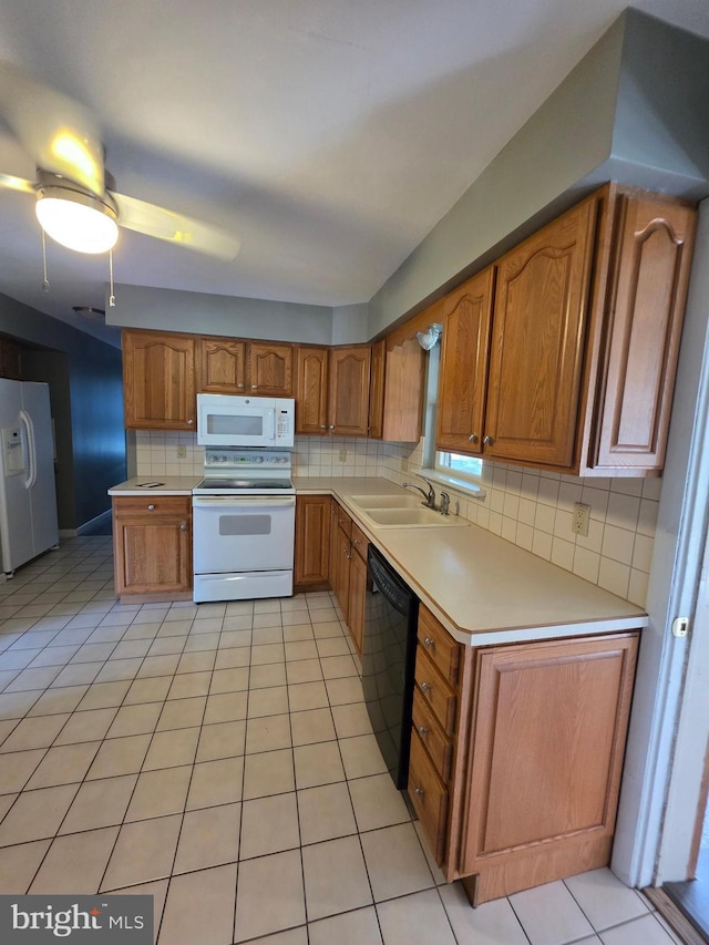 616 Sylvan Pl, Harrisburg, PA 17109 - kitchen featuring white appliances, brown cabinets, backsplash, and light countertops