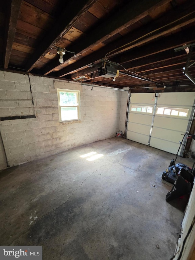 616 Sylvan Pl, Harrisburg, PA 17109 - garage with a garage door opener and concrete block wall