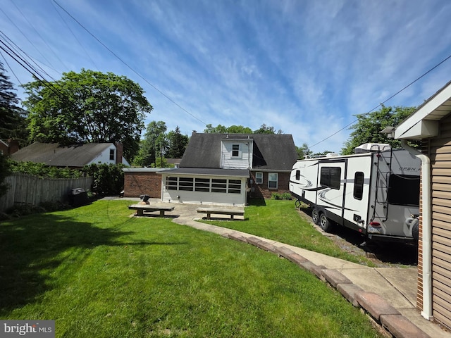 616 Sylvan Pl, Harrisburg, PA 17109 - back of house featuring a sunroom and brick siding