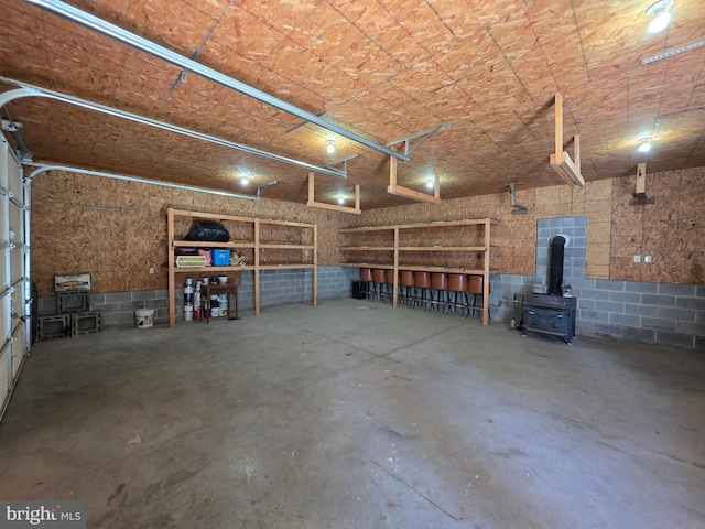 616 Sylvan Pl, Harrisburg, PA 17109 - garage with a wood stove and concrete block wall
