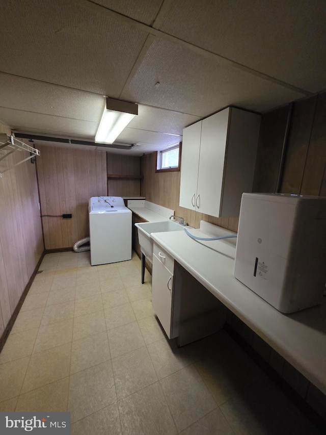 616 Sylvan Pl, Harrisburg, PA 17109 - laundry room featuring washer / dryer, wood walls, and cabinet space