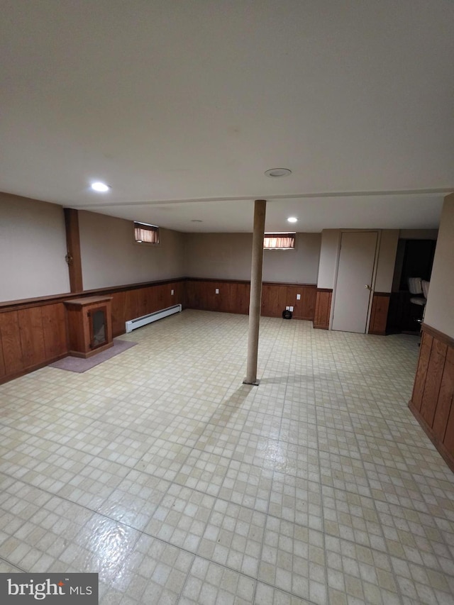 616 Sylvan Pl, Harrisburg, PA 17109 - below grade area featuring baseboard heating, a wainscoted wall, and wooden walls