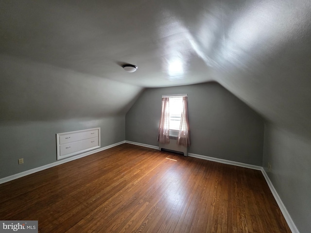 616 Sylvan Pl, Harrisburg, PA 17109 - additional living space with wood finished floors, vaulted ceiling, baseboards, and radiator