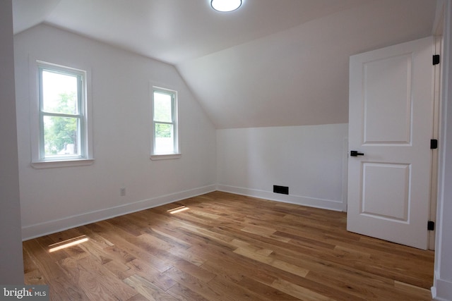 2 Baltimore Ave, Glen Burnie, MD 21061 - additional living space with vaulted ceiling, light wood-type flooring, and baseboards