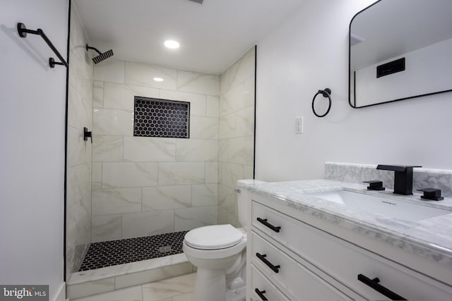 2 Baltimore Ave, Glen Burnie, MD 21061 - bathroom featuring marble finish flooring, tiled shower, vanity, toilet, and recessed lighting
