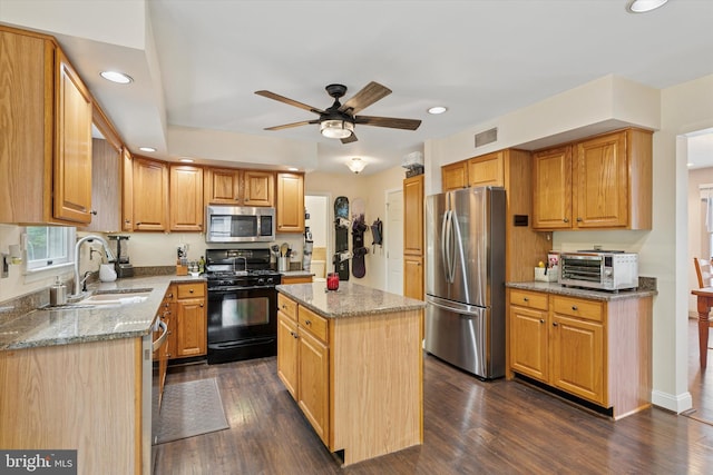 504 Ridge Dr, Douglassville, PA 19518 - kitchen with stainless steel appliances, a sink, light stone countertops, a ceiling fan, and recessed lighting