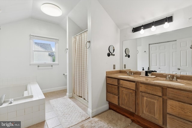 504 Ridge Dr, Douglassville, PA 19518 - full bath with tile patterned floors, vaulted ceiling, a stall shower, a garden tub, and double vanity