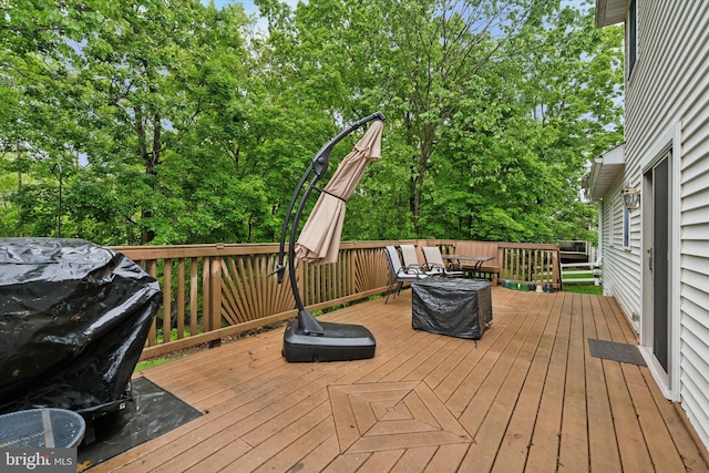 504 Ridge Dr, Douglassville, PA 19518 - wooden deck featuring view of wooded area and a grill
