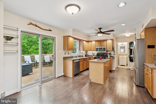 504 Ridge Dr, Douglassville, PA 19518 - kitchen with appliances with stainless steel finishes, a kitchen island, a sink, dark wood-style floors, and ceiling fan