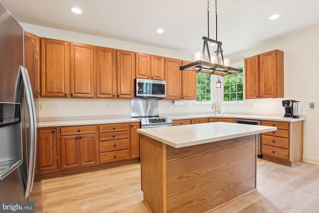 831 Macalister Dr SE, Leesburg, VA 20175 - kitchen with appliances with stainless steel finishes, light wood-type flooring, brown cabinetry, recessed lighting, and a sink