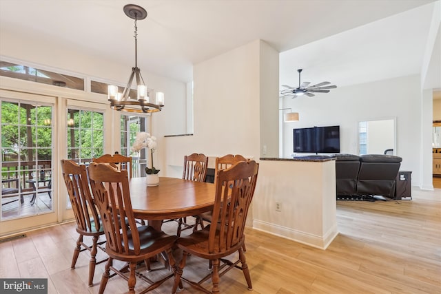 831 Macalister Dr SE, Leesburg, VA 20175 - dining area with light wood-style flooring, a chandelier, ceiling fan, and baseboards