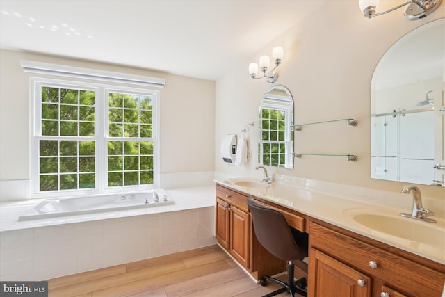 831 Macalister Dr SE, Leesburg, VA 20175 - bathroom with wood finished floors, plenty of natural light, double vanity, and a bath