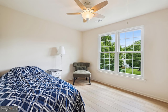 831 Macalister Dr SE, Leesburg, VA 20175 - bedroom with wood finished floors, baseboards, and a ceiling fan