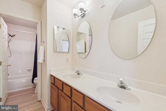 831 Macalister Dr SE, Leesburg, VA 20175 - full bathroom featuring toilet, wood finished floors, double vanity, and shower / bathtub combination with curtain