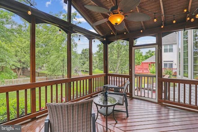 831 Macalister Dr SE, Leesburg, VA 20175 - sunroom with a ceiling fan and view of scattered trees