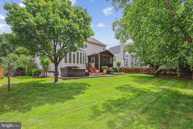 831 Macalister Dr SE, Leesburg, VA 20175 - view of yard featuring a sunroom and a hot tub
