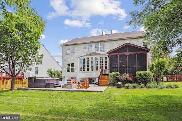 831 Macalister Dr SE, Leesburg, VA 20175 - rear view of house with a hot tub, a sunroom, and a patio