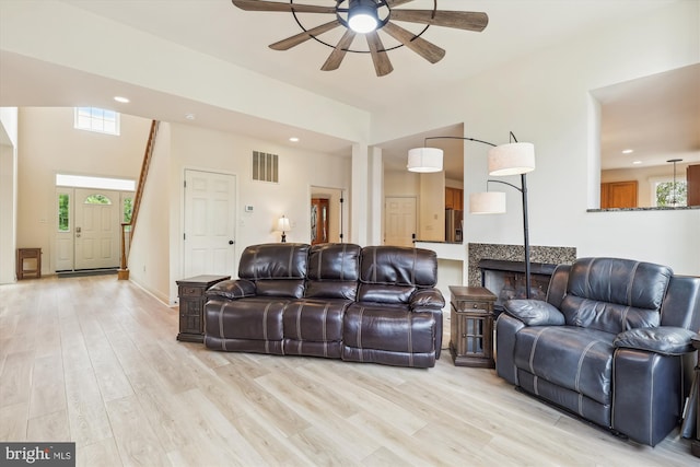 831 Macalister Dr SE, Leesburg, VA 20175 - living area with a ceiling fan, healthy amount of natural light, light wood finished floors, and recessed lighting