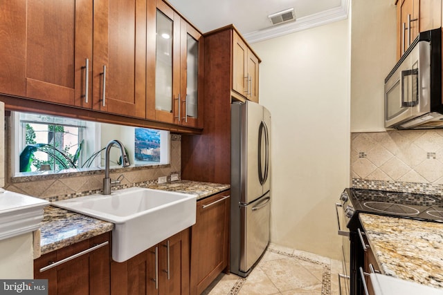 306 S 13th St Unit 8, Philadelphia, PA 19107 - kitchen with stainless steel appliances, a sink, tasteful backsplash, crown molding, and light stone counters