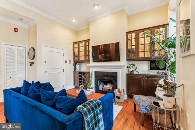 306 S 13th St Unit 8, Philadelphia, PA 19107 - living area with wood finished floors, a fireplace, ornamental molding, baseboards, and recessed lighting