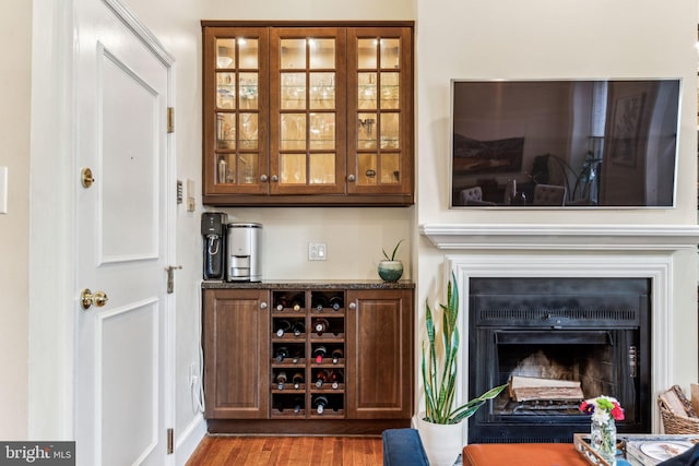 306 S 13th St Unit 8, Philadelphia, PA 19107 - bar area featuring wood finished floors and a fireplace