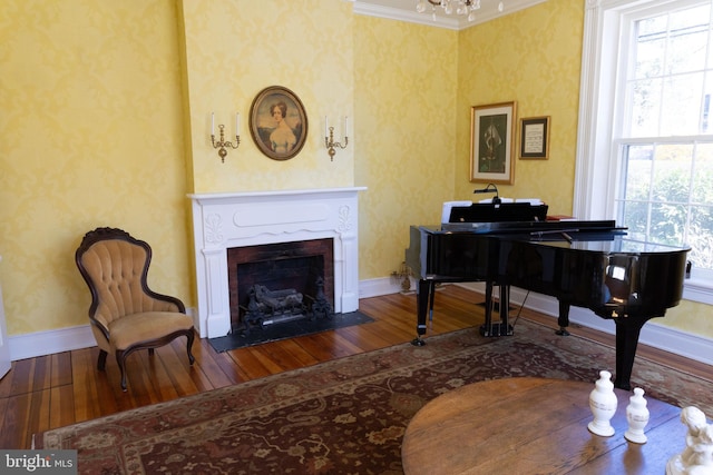 322 Main St E, Fincastle, VA 24090 - sitting room with hardwood / wood-style flooring, plenty of natural light, baseboards, a fireplace with flush hearth, and wallpapered walls
