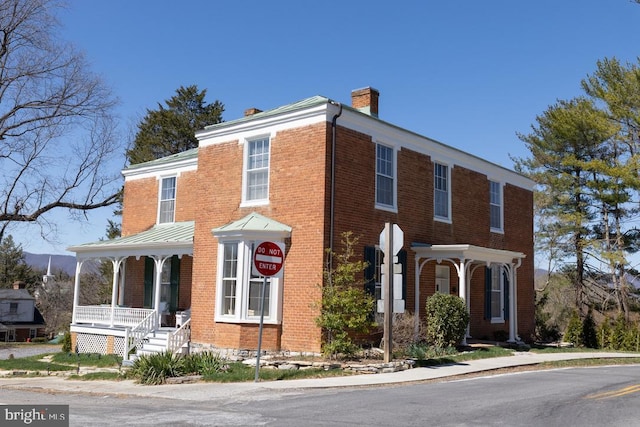 322 Main St E, Fincastle, VA 24090 - view of front of house with a chimney, a porch, and brick siding