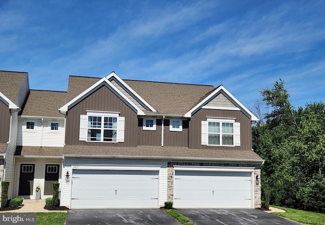 409 Landover Ct, Enola, PA 17025 - townhome / multi-family property with an attached garage, driveway, a shingled roof, and stone siding