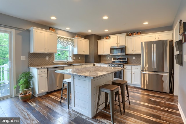 409 Landover Ct, Enola, PA 17025 - kitchen with appliances with stainless steel finishes, white cabinetry, dark wood-type flooring, and recessed lighting