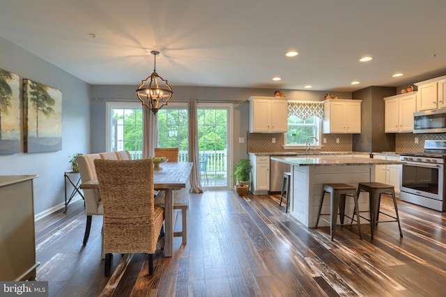 409 Landover Ct, Enola, PA 17025 - dining room featuring dark wood-style flooring, a chandelier, baseboards, and recessed lighting