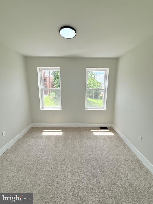 2112 Llewelyn Ave, Baltimore, MD 21213 - spare room featuring plenty of natural light and baseboards