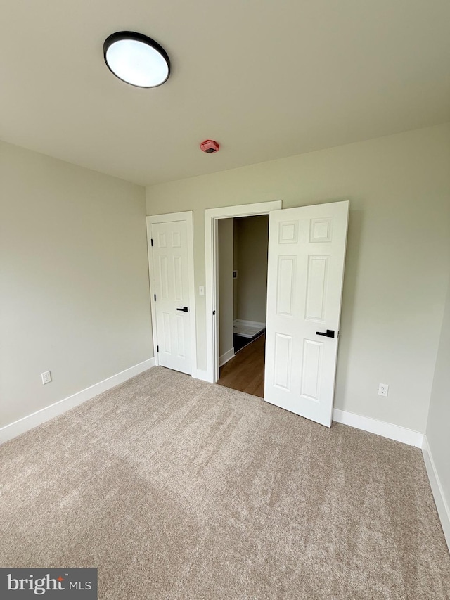 2112 Llewelyn Ave, Baltimore, MD 21213 - unfurnished bedroom with carpet and baseboards