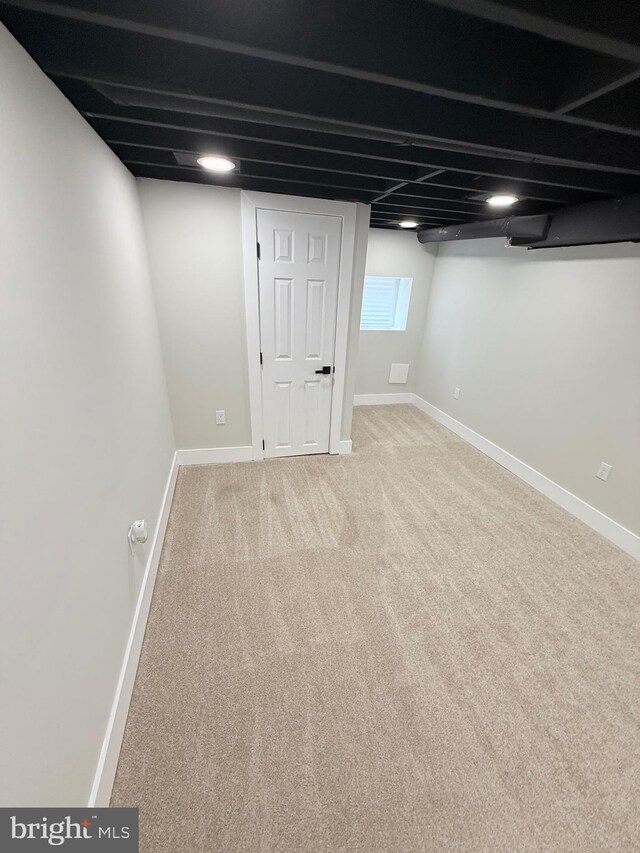2112 Llewelyn Ave, Baltimore, MD 21213 - basement featuring carpet floors and baseboards
