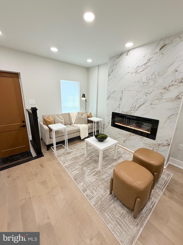 2112 Llewelyn Ave, Baltimore, MD 21213 - living room featuring recessed lighting, a fireplace, and wood finished floors