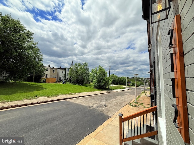 2112 Llewelyn Ave, Baltimore, MD 21213 - view of asphalt street featuring street lighting, curbs, and sidewalks