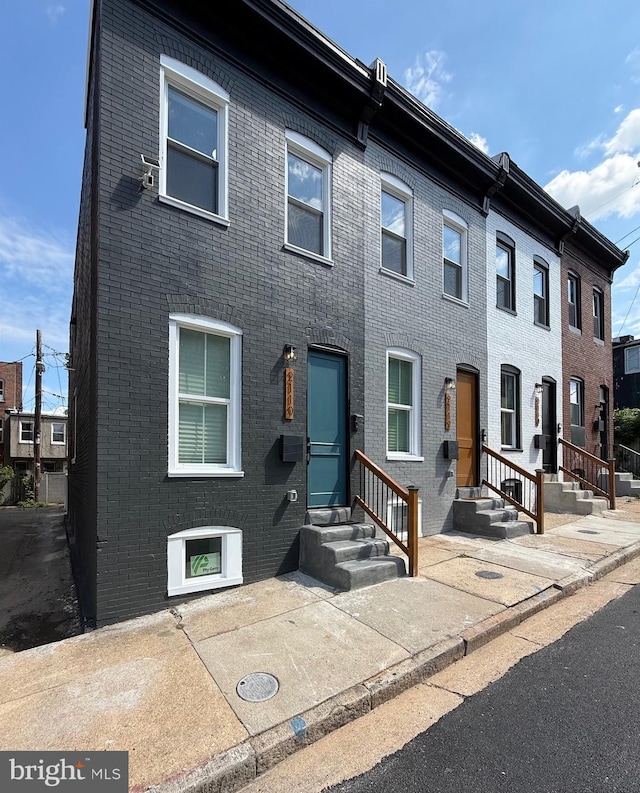 2112 Llewelyn Ave, Baltimore, MD 21213 - townhome / multi-family property with brick siding and entry steps