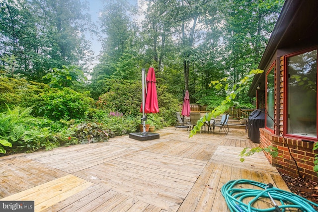 6662 Van Winkle Dr, Falls Church, VA 22044 - wooden terrace featuring outdoor dining area, view of scattered trees, and a grill