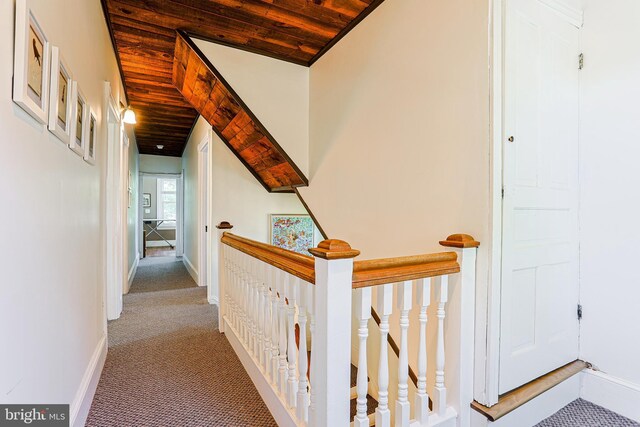 922 8th Ave, Prospect Park, PA 19076 - hallway featuring light carpet, an upstairs landing, wood ceiling, and baseboards