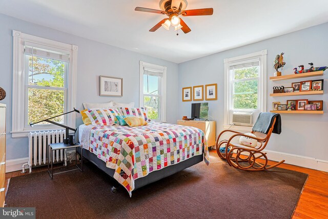 922 8th Ave, Prospect Park, PA 19076 - bedroom with radiator heating unit, multiple windows, wood finished floors, and baseboards