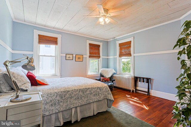 922 8th Ave, Prospect Park, PA 19076 - bedroom with radiator heating unit, multiple windows, hardwood / wood-style floors, wood ceiling, and crown molding