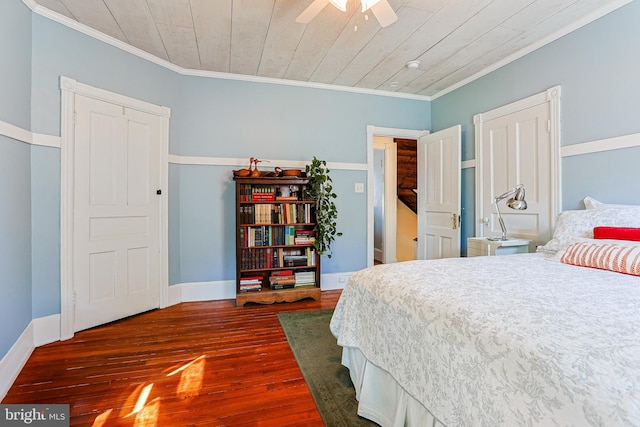 922 8th Ave, Prospect Park, PA 19076 - bedroom with dark wood finished floors, crown molding, wooden ceiling, and baseboards