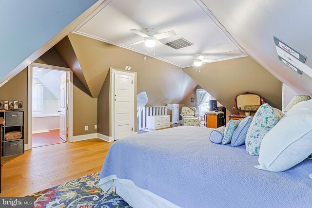 922 8th Ave, Prospect Park, PA 19076 - bedroom with wood finished floors, lofted ceiling, baseboards, a ceiling fan, and ensuite bathroom