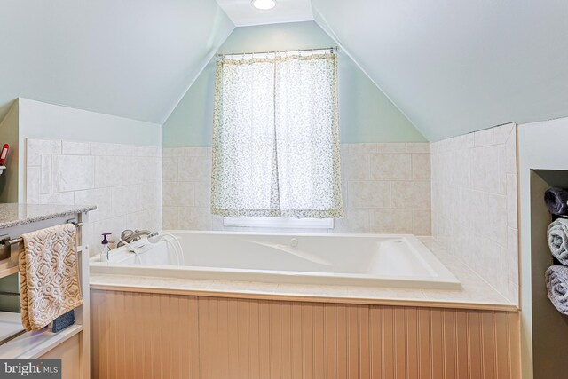 922 8th Ave, Prospect Park, PA 19076 - bathroom with lofted ceiling and a bath