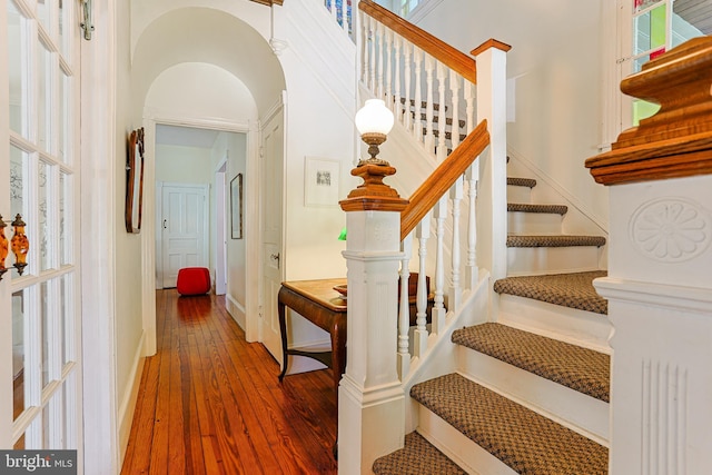 922 8th Ave, Prospect Park, PA 19076 - staircase with hardwood / wood-style floors, baseboards, and arched walkways