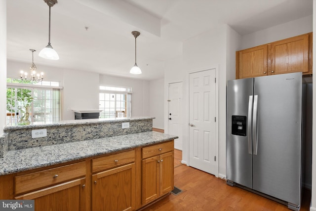 13800 Breezy Ridge Way Unit 101, Woodbridge, VA 22191 - kitchen with stainless steel fridge with ice dispenser, light wood-style flooring, healthy amount of natural light, and light stone counters