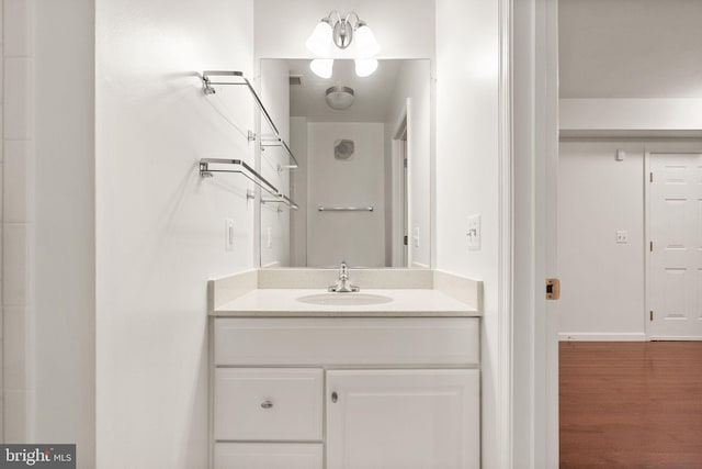 13800 Breezy Ridge Way Unit 101, Woodbridge, VA 22191 - bathroom with vanity and wood finished floors
