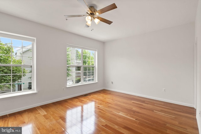 13800 Breezy Ridge Way Unit 101, Woodbridge, VA 22191 - spare room with light wood finished floors, baseboards, and a ceiling fan