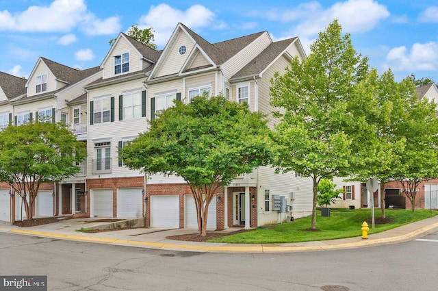 13800 Breezy Ridge Way Unit 101, Woodbridge, VA 22191 - view of property with brick siding, a garage, and concrete driveway