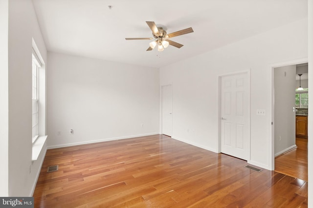 13800 Breezy Ridge Way Unit 101, Woodbridge, VA 22191 - spare room featuring a ceiling fan, light wood-type flooring, baseboards, and fire sprinkler in ceiling
