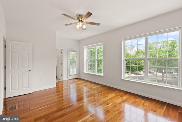 13800 Breezy Ridge Way Unit 101, Woodbridge, VA 22191 - unfurnished room with baseboards, a ceiling fan, and wood finished floors
